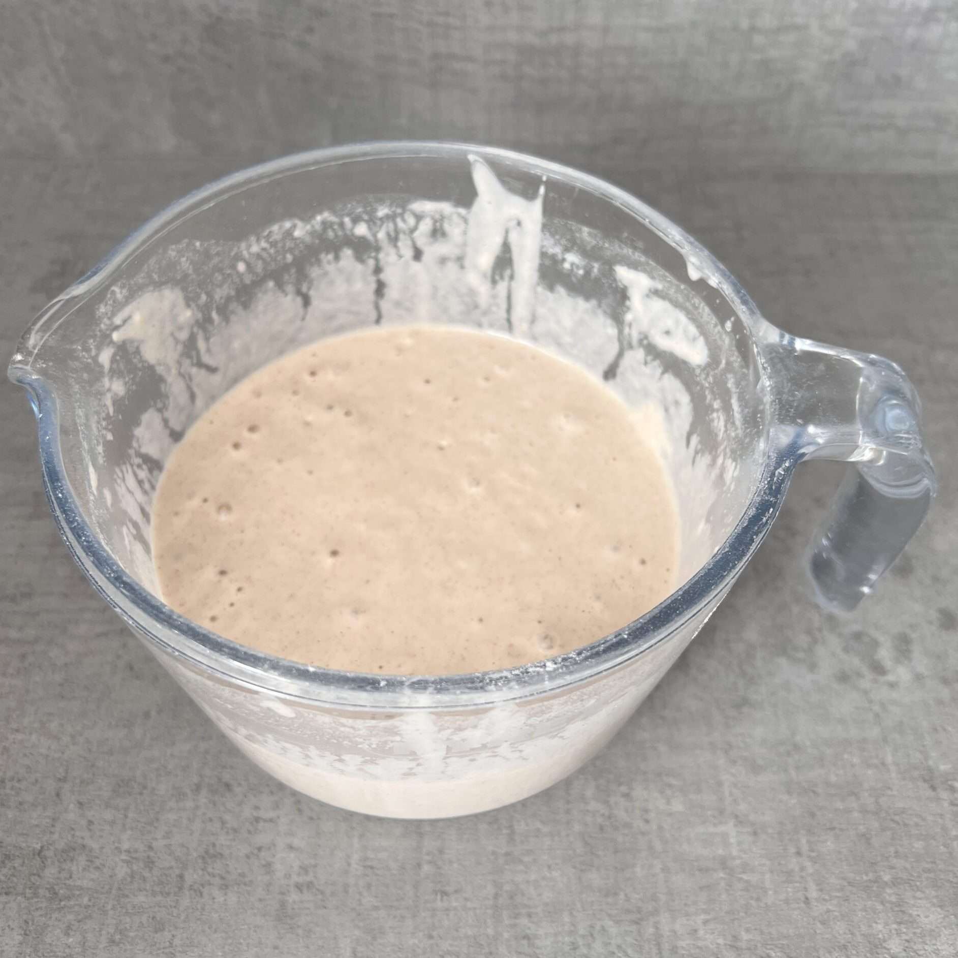 Beer batter standing in a jug ready for using.