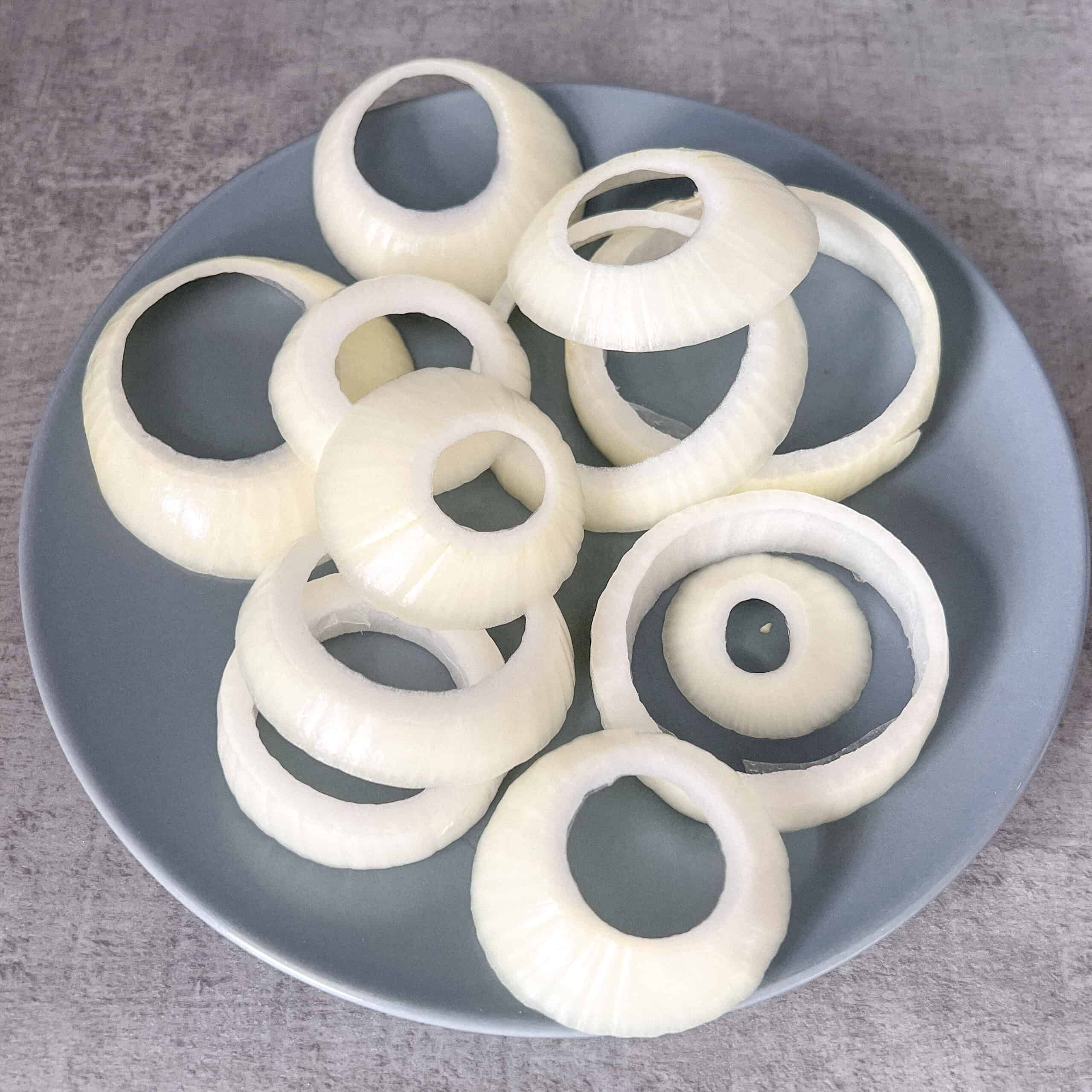 Onions sliced ready for dipping in batter.