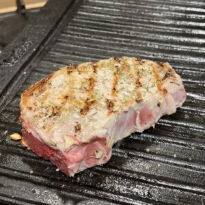 Place the raw pork chop on the griddle.