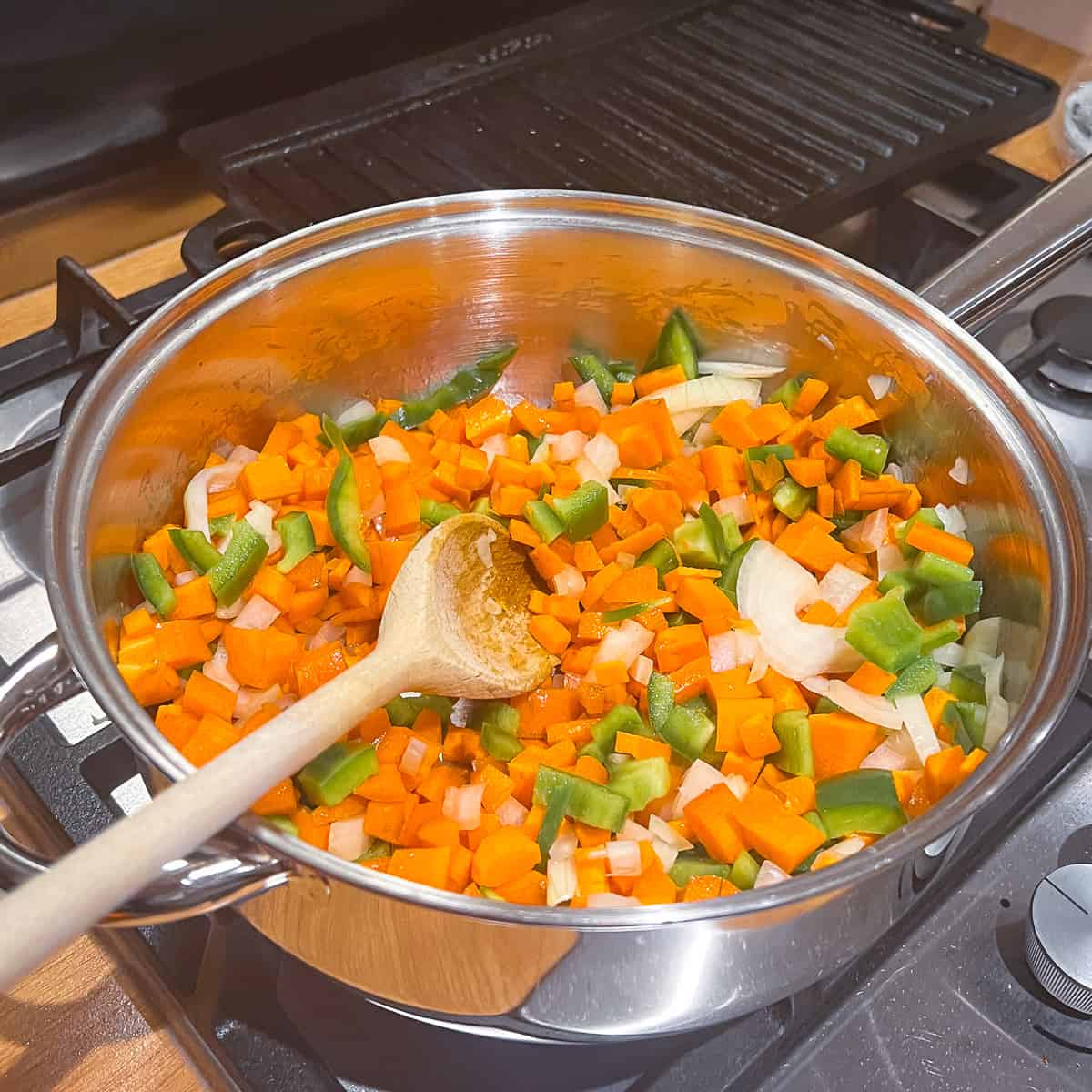 simmering onion carrot and pepper