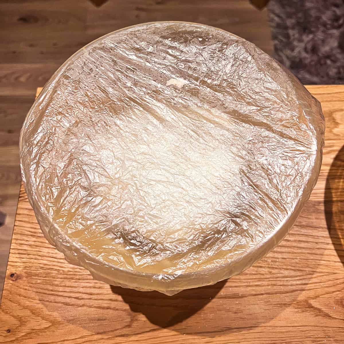 Bread rising covered with a shower cap.