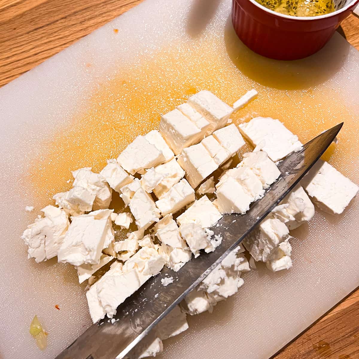 diced feta cheese and knife