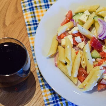 greek feta pasta salad and a glass of coke