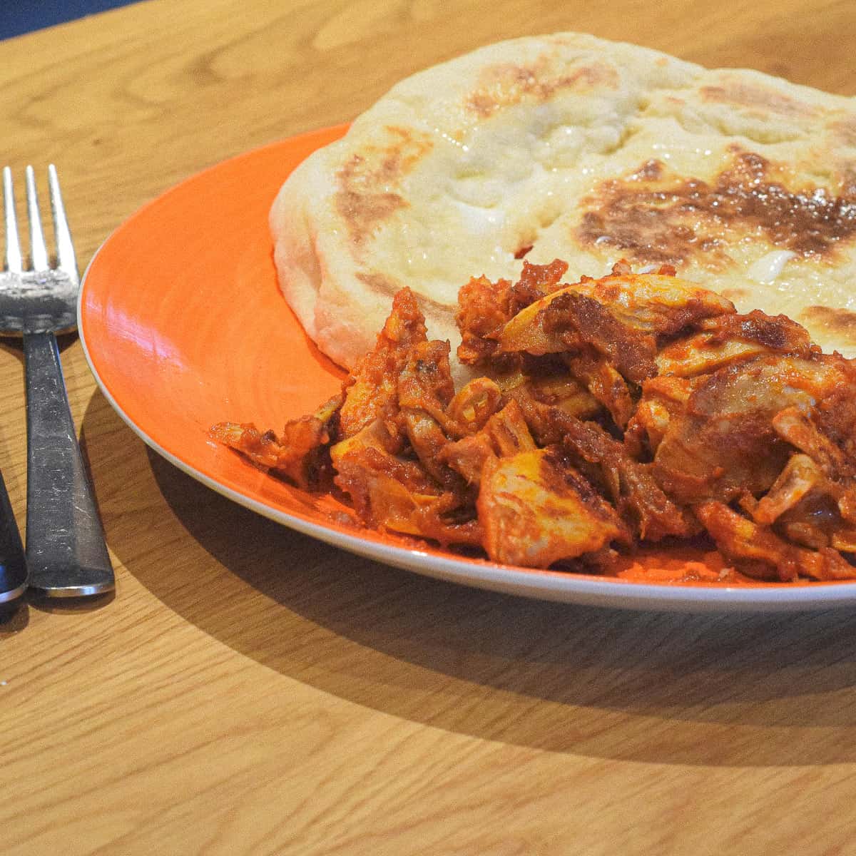 nduja chicken and naan bread and fork