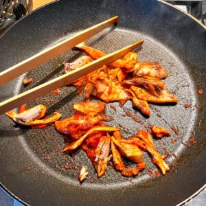 nduja chicken cooking in a frying pan
