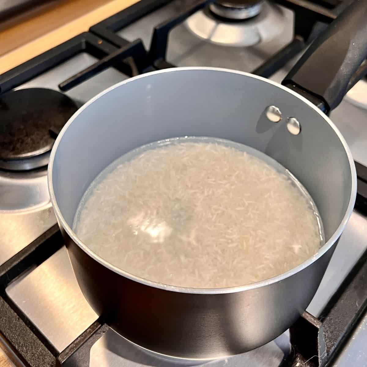 Soaked rice in a pan.