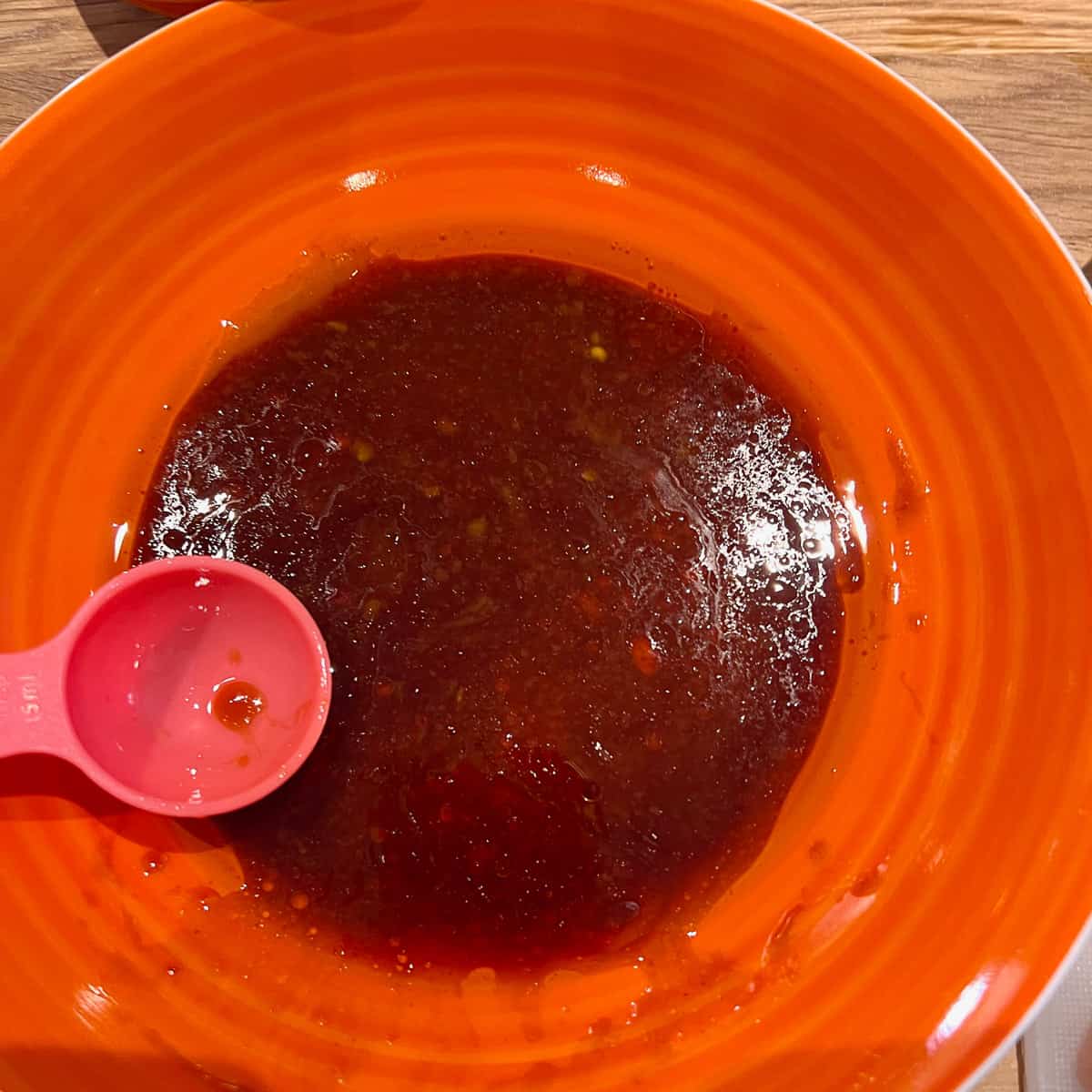Soy and peri peri sauce mixed in a bowl.
