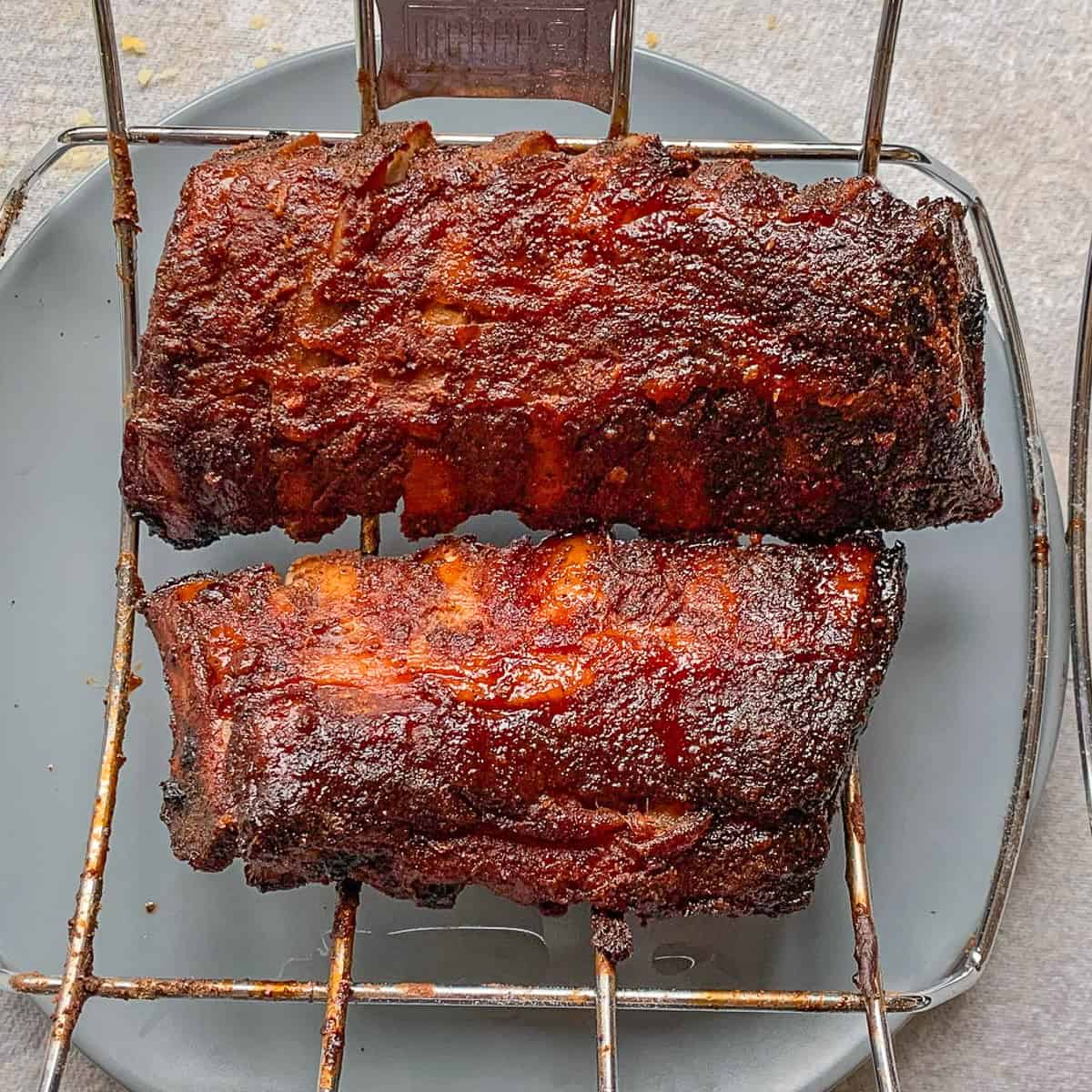 Succulent BBQ ribs on a rack.