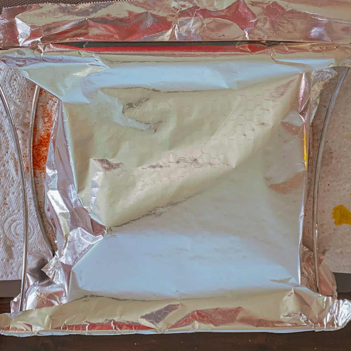 Wrapped foil with BBQ ribs inside.