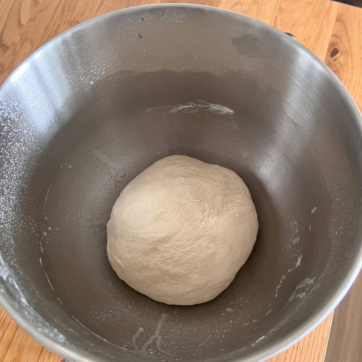 Freshly mixed dough in a bowl.