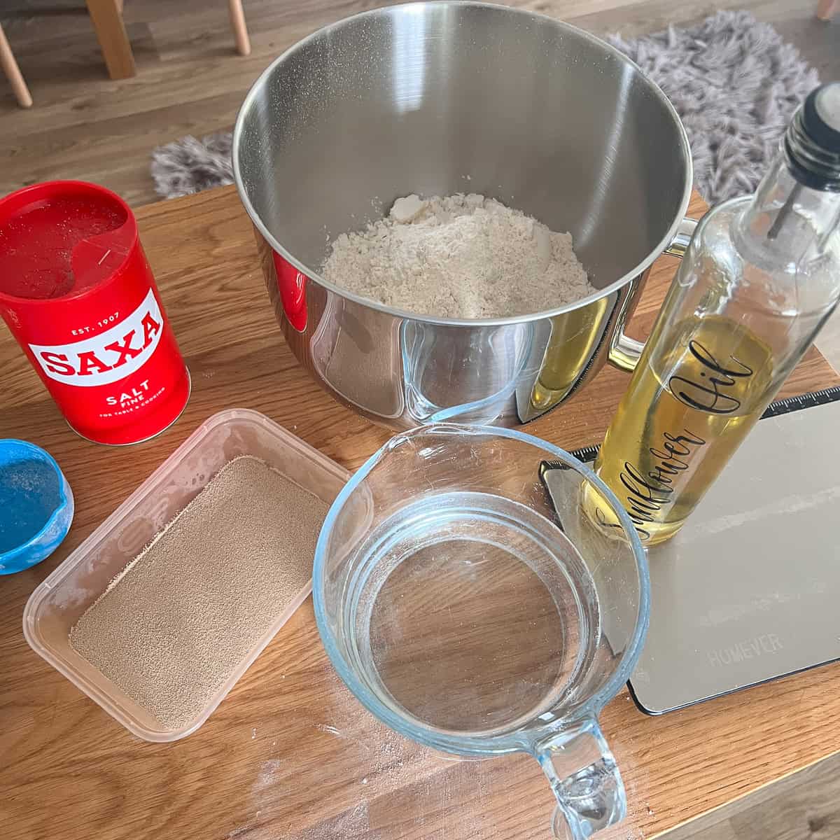 Various ingredients needed to make a white loaf.