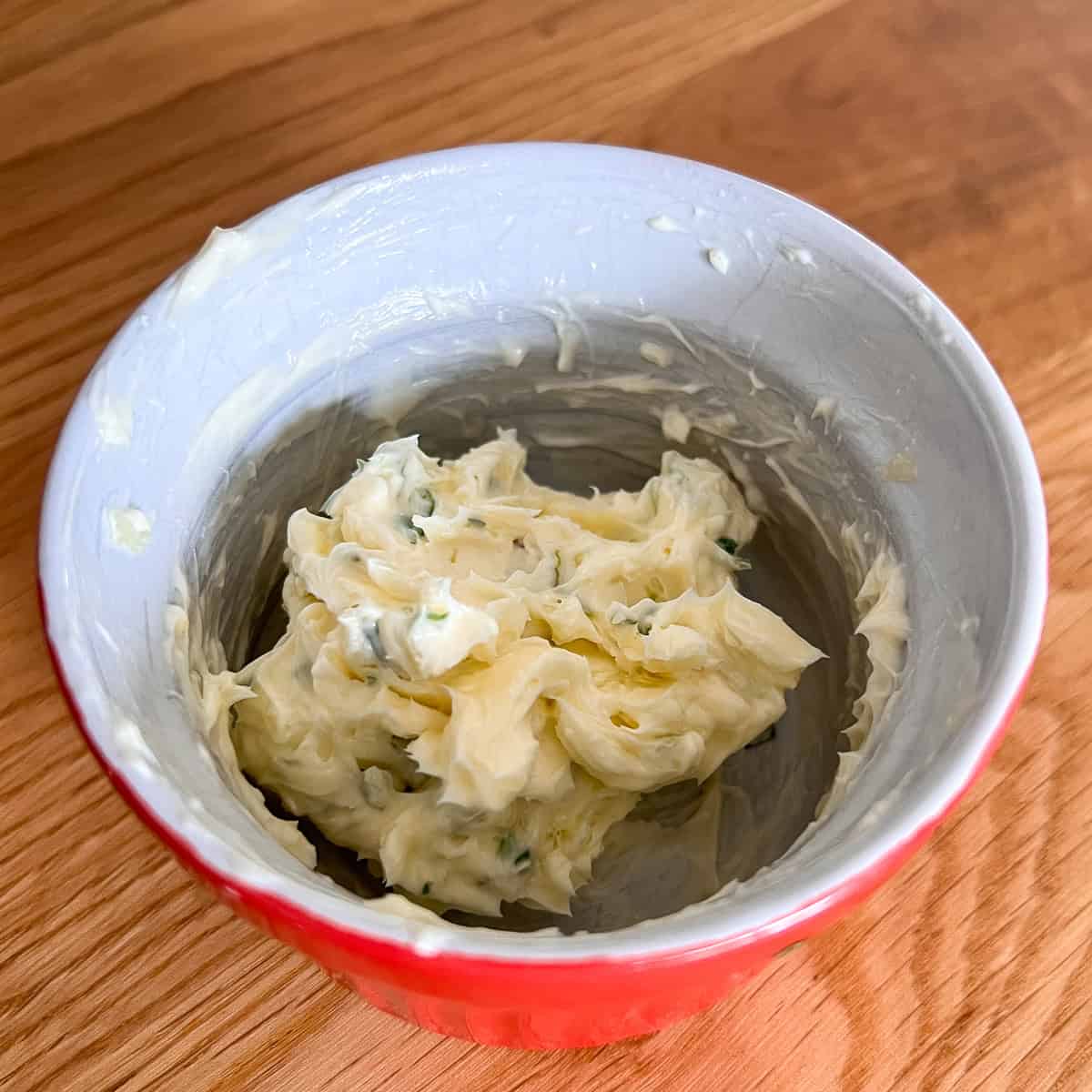 Garlic and herbs butter in a dish.