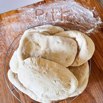 Pitta bread on a cooling rack.