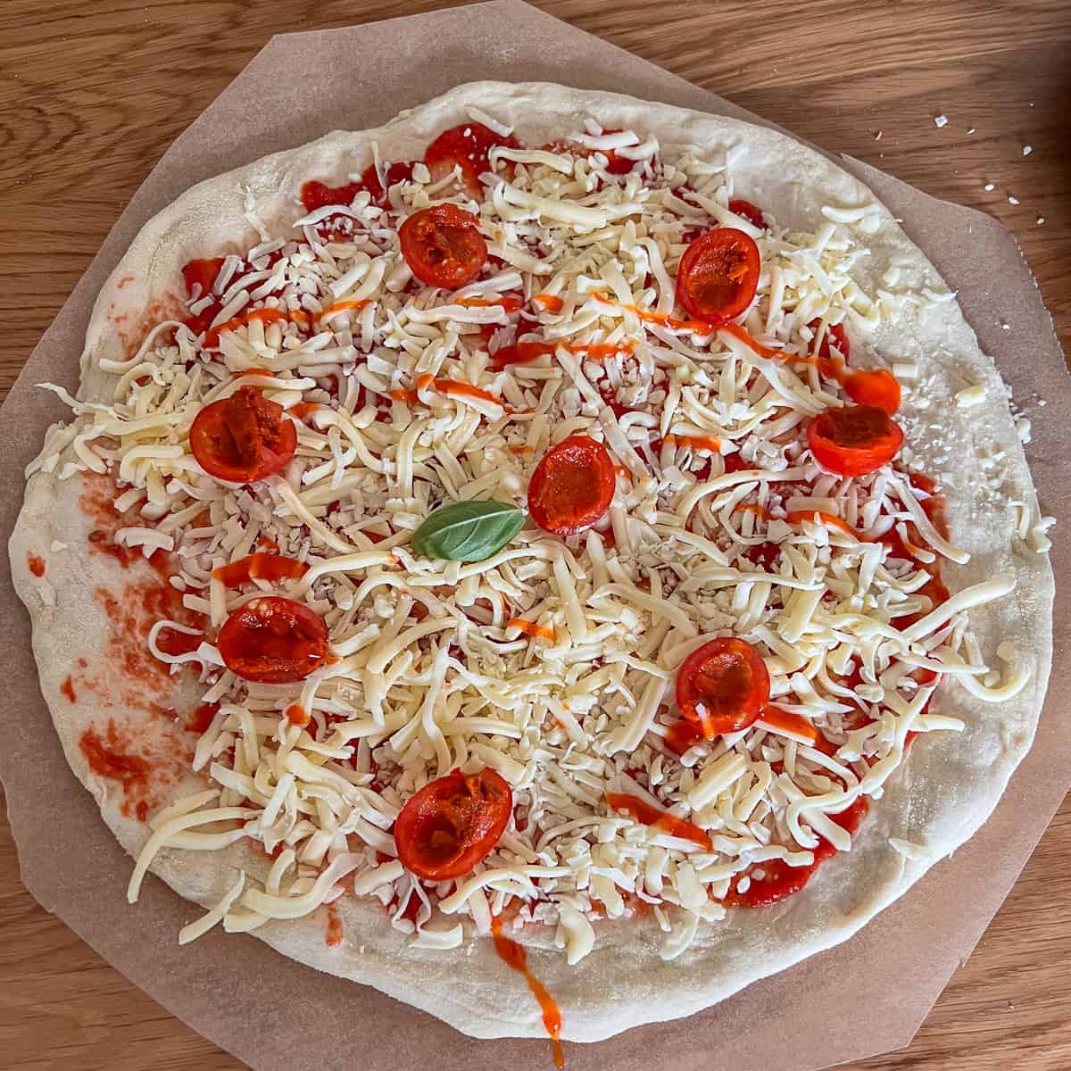 Uncooked tomato and nduja pizza.