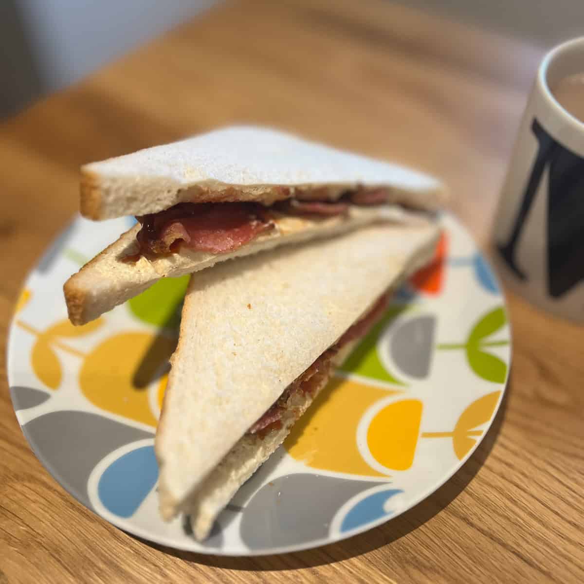 Bacon sandwich on a plate.