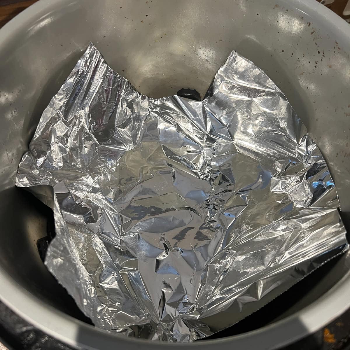 Line an air fryer with foil.