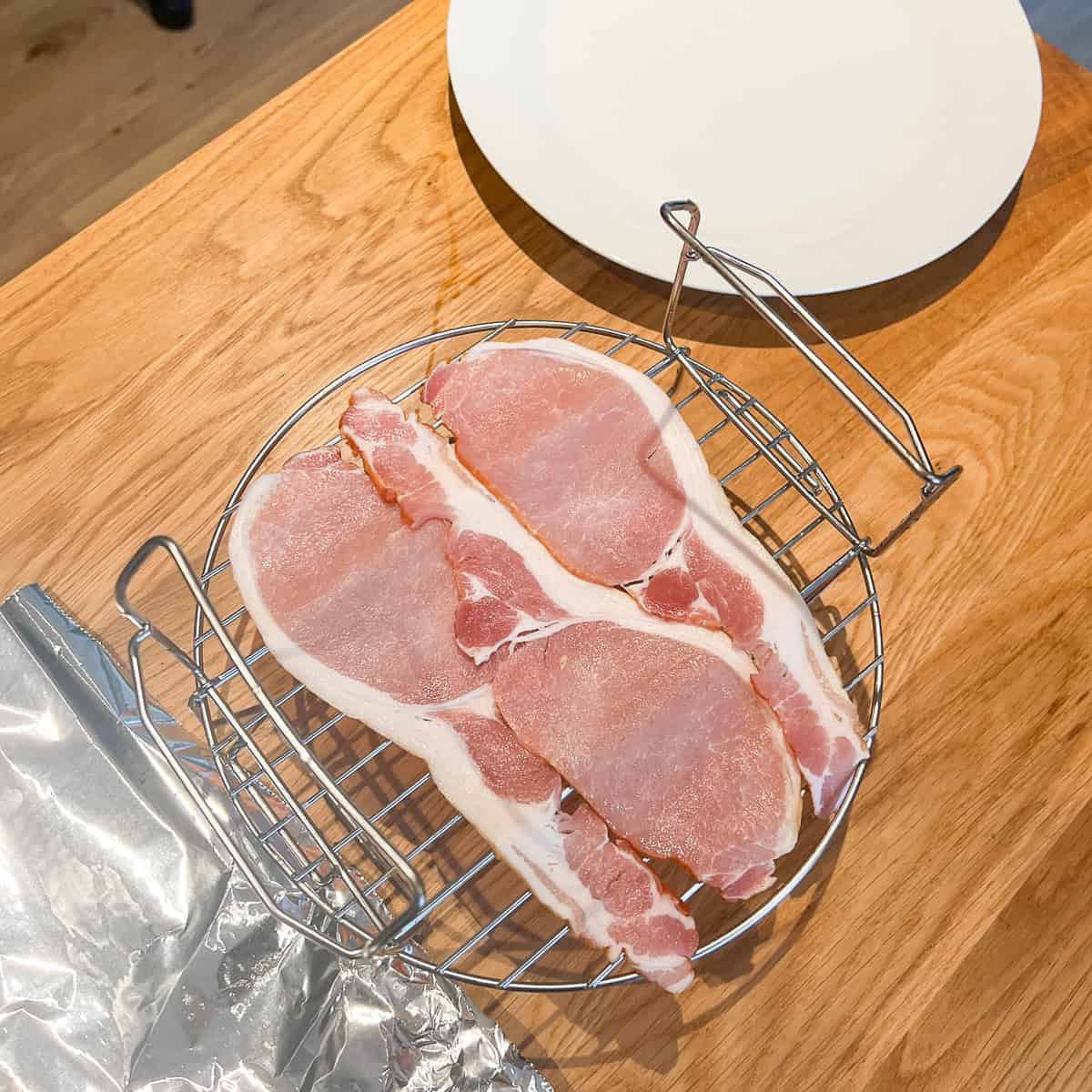 Bacon on a rack with some foil.