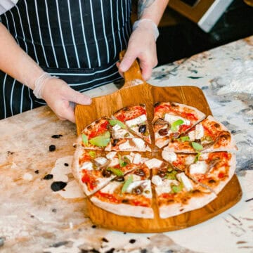 Pizza on a chopping board.