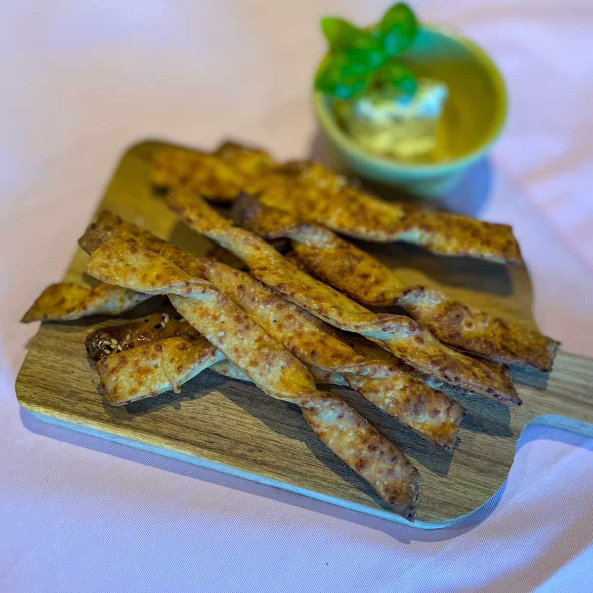 Cheese straws on a serving platter.