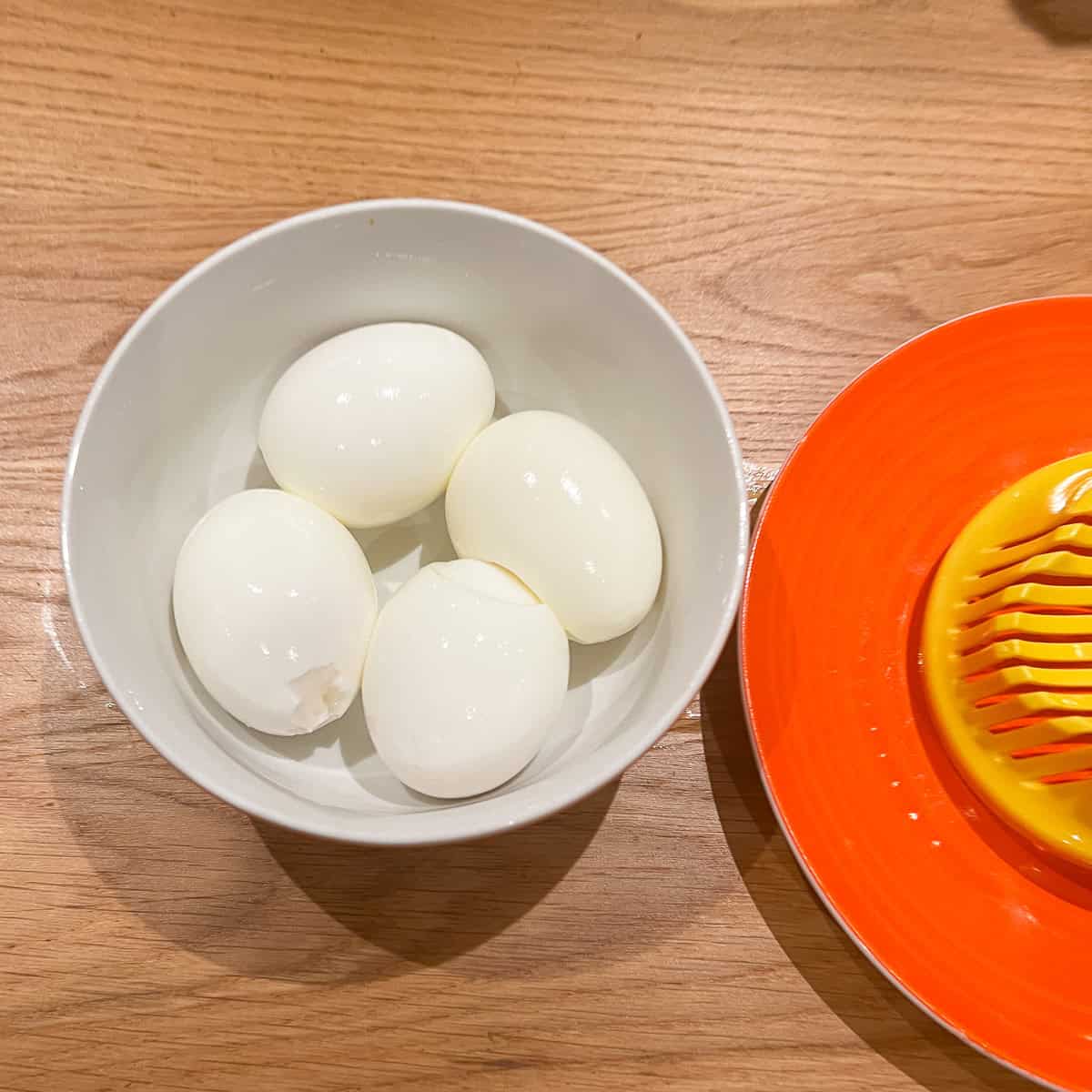 4 hard boiled eggs in a bowl.