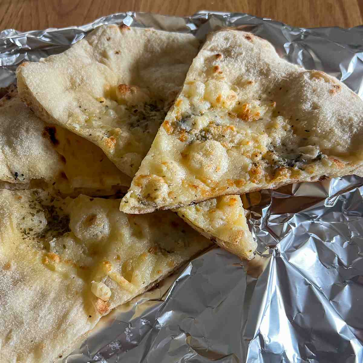 Image of Reheating leftover pizza on foil.