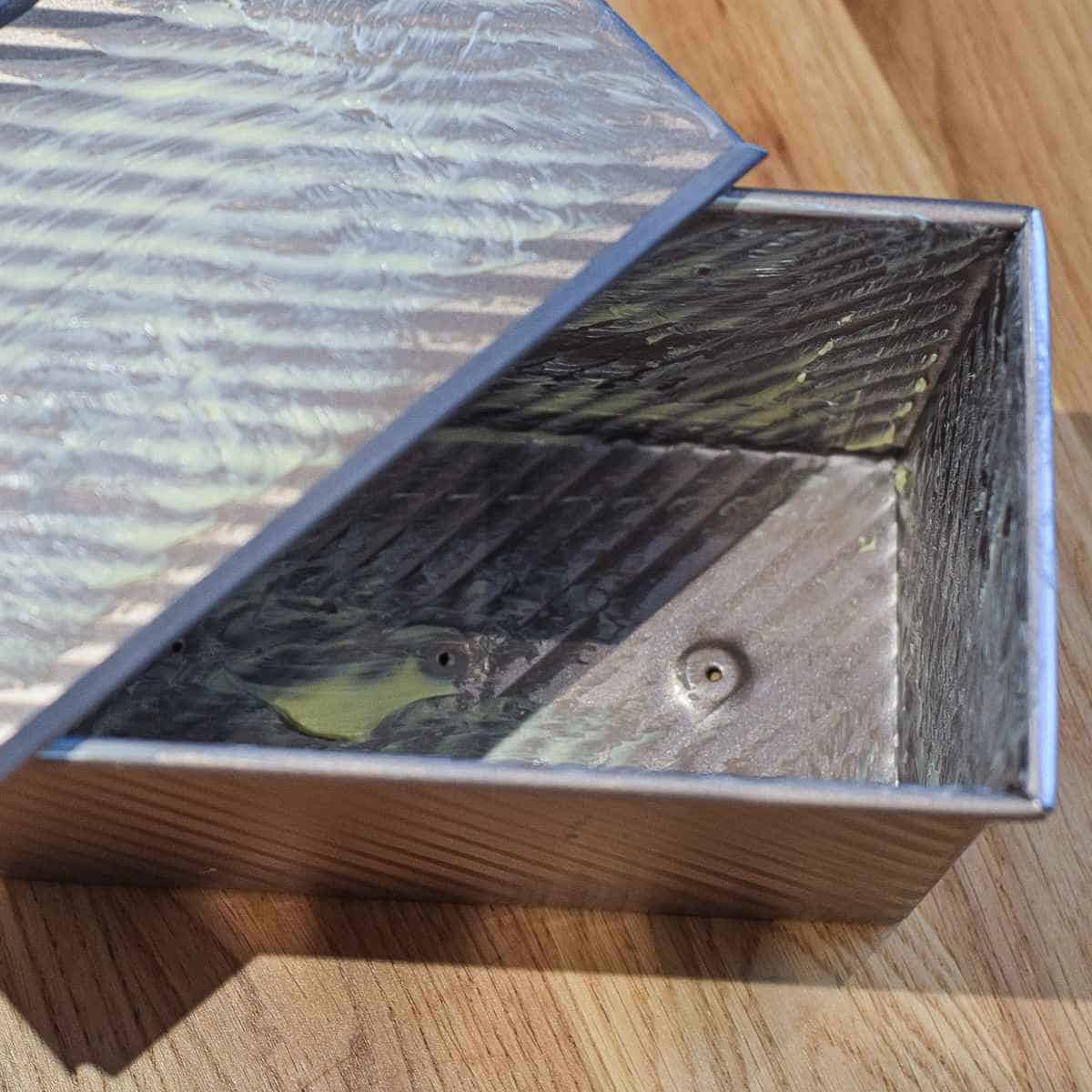 Pullman loaf tin greased with butter.