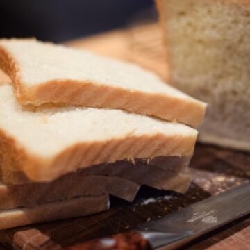 Thick slices of bread and a bread knife.