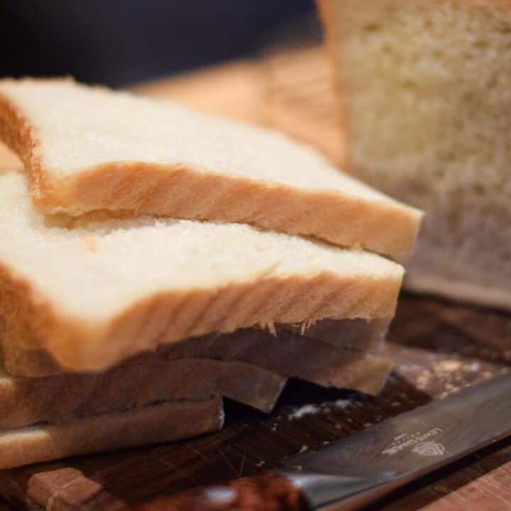 Thick slices of bread and a bread knife.
