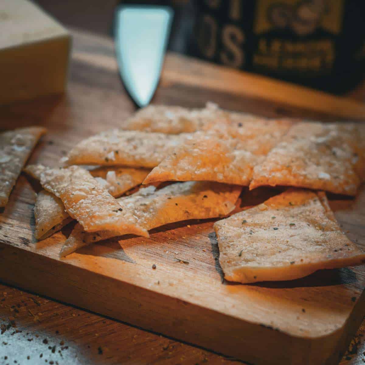 Sourdough discard lemon herb bites on a charcuterie board.