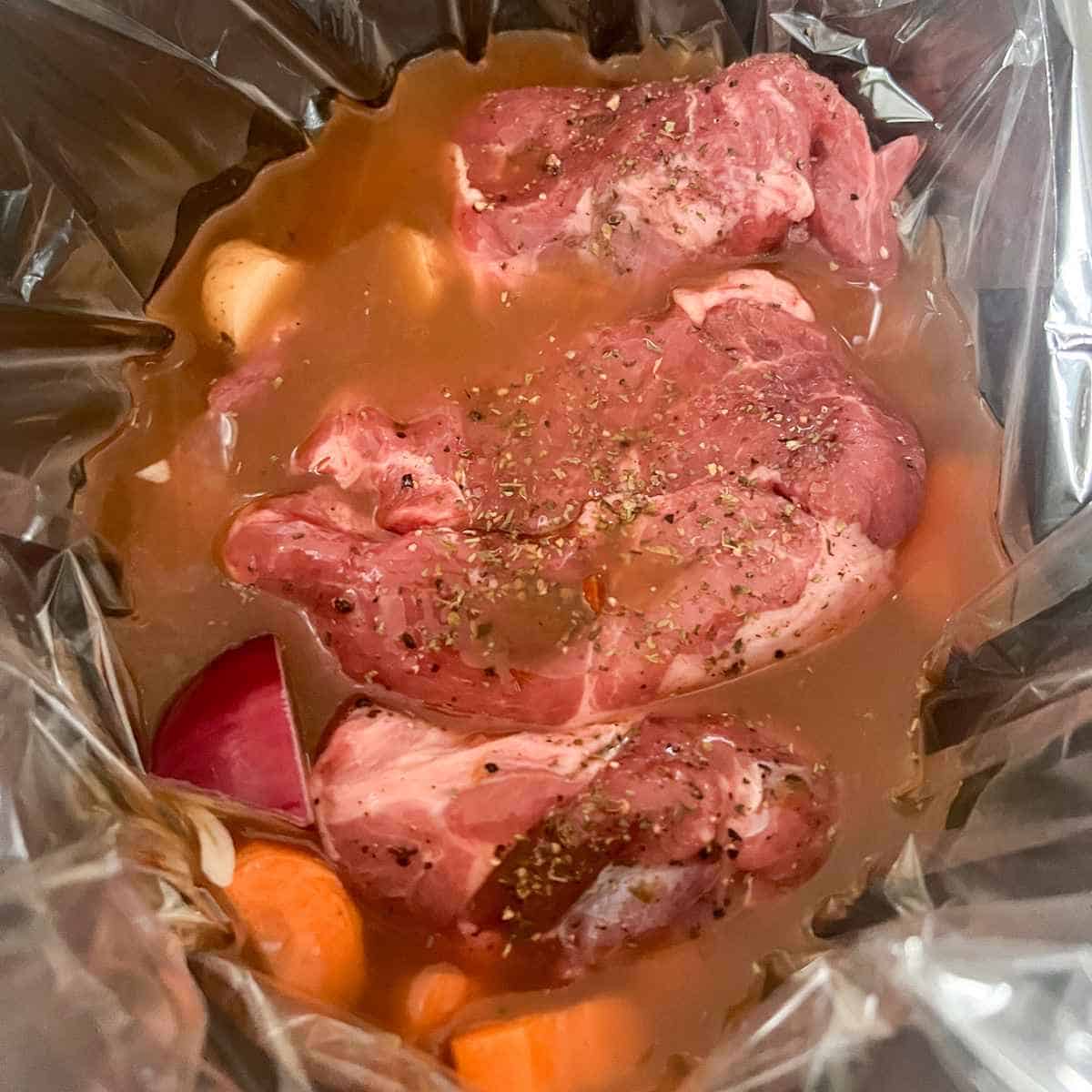 Lamb stew mid way through cooking in slow cooker.