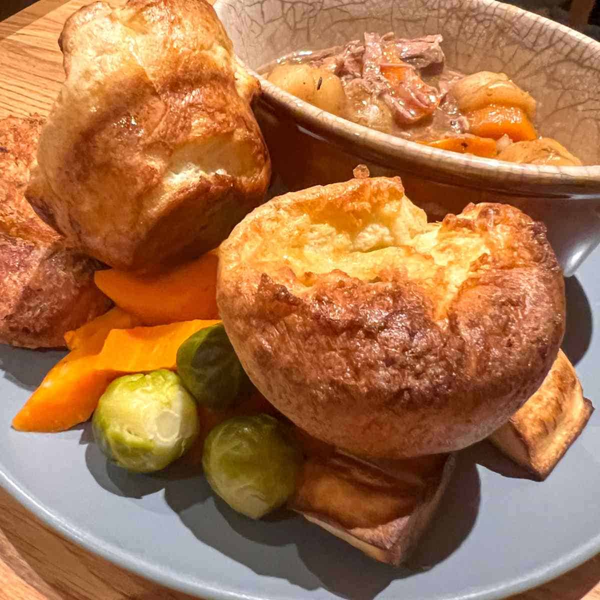 Lamb stew served with Yorkshire pudding