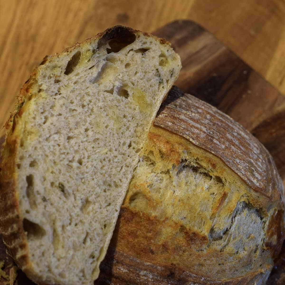 Cheese and basil sourdough bread sliced.
