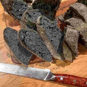 Black charcoal sourdough bread sliced.