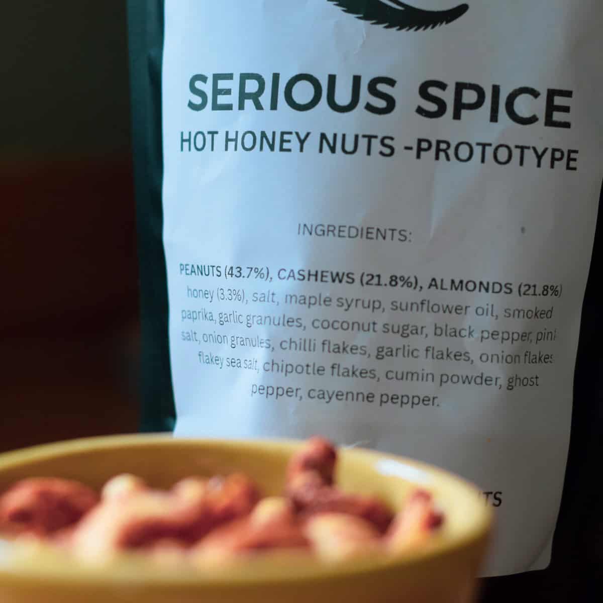 Spicy honey-coated nuts with chili flakes and cumin for a flavourful snack.