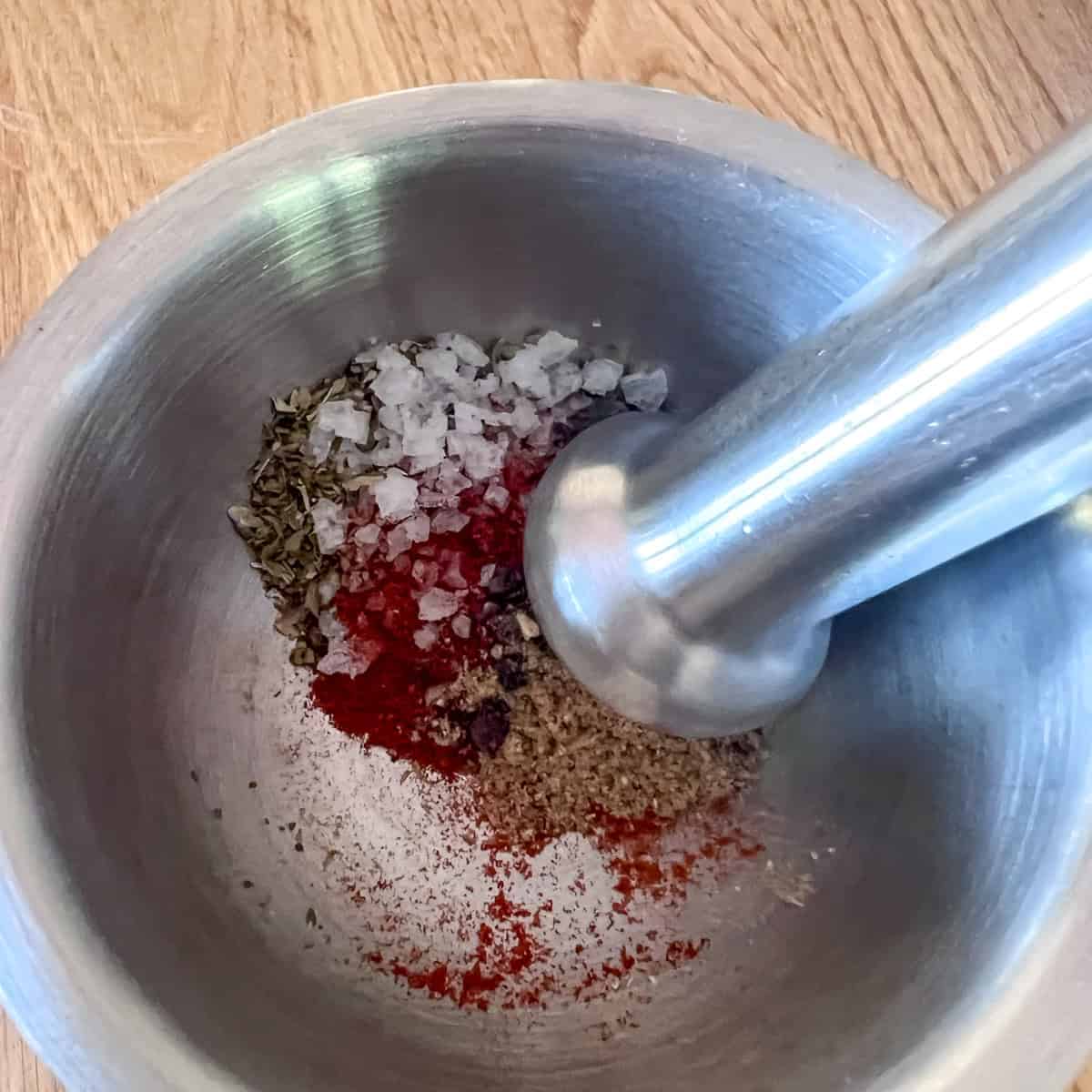 Mexican flavour spice dry rub in a pestle and mortar.