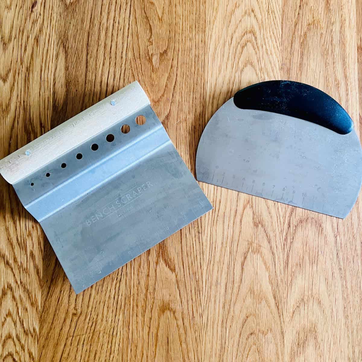 Pair of metal bench dough scrapers.