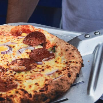 Pepperoni Pizza on a pizza peel.